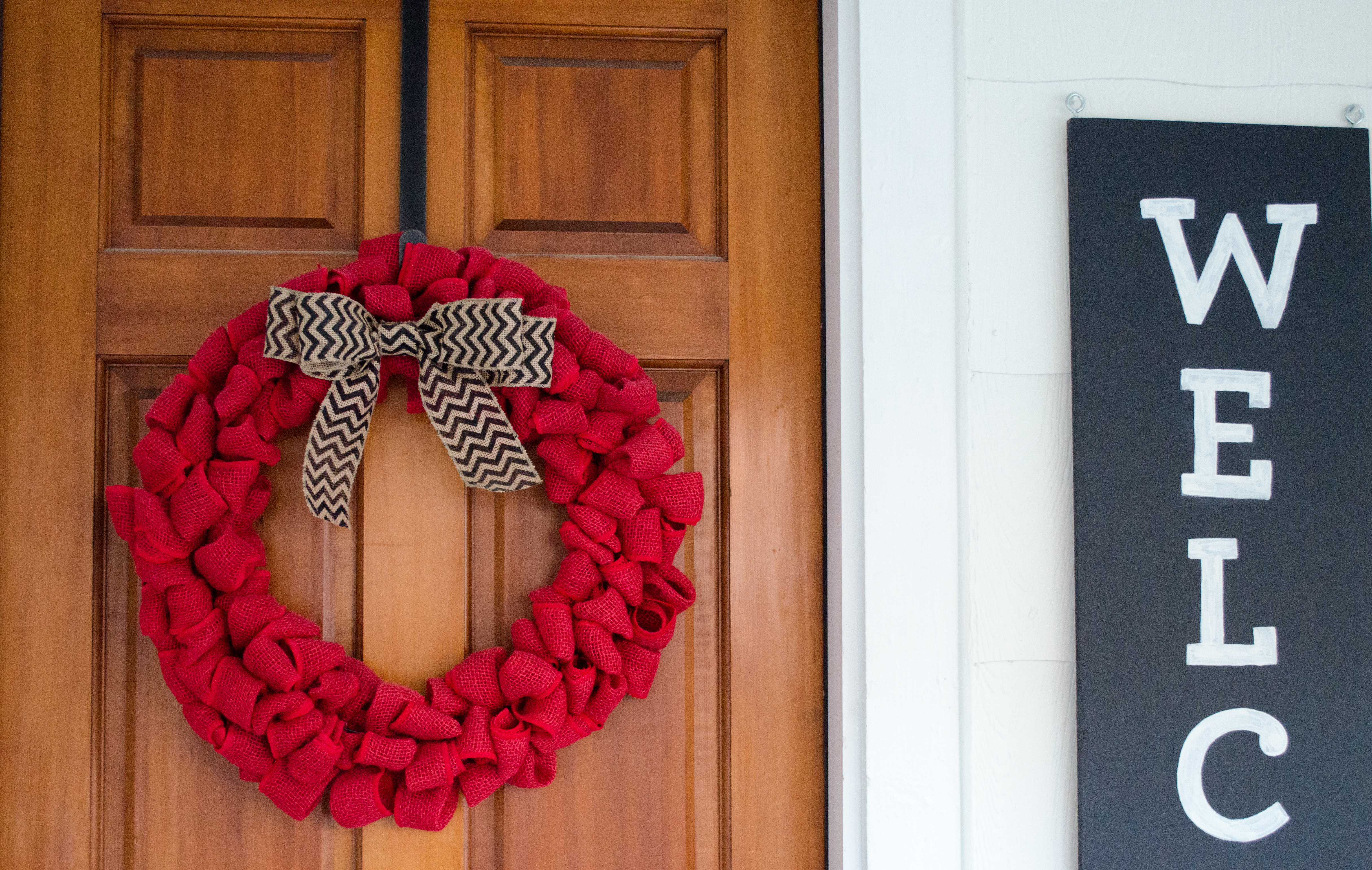 Valentine's day wreath and chalkboard welcome sign.